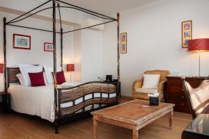 Postel nebo postele na pokoji v ubytování L'Aubinière Hôtel Restaurant & Spa + 37 fotografií