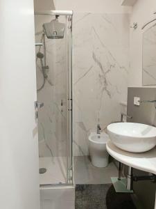 a bathroom with a shower and a toilet and a sink at Le Suite Angelo&Alice Mini in Marsala +69 photos