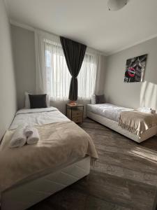 Ένα ή περισσότερα κρεβάτια σε δωμάτιο στο Tanov Cozy Place