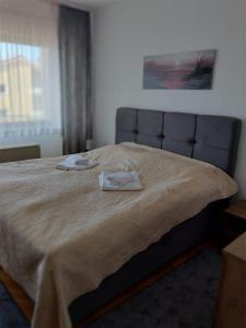 a bedroom with a bed with two towels on it at Villa Feodora in Biograd na Moru +53 photos