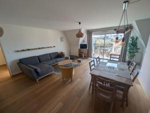 a living room with a couch and a table at WimSaens in Wimereux