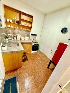 a kitchen with a sink and a stove at Axon Cozy Modern House G Near The Walking Street in Angeles