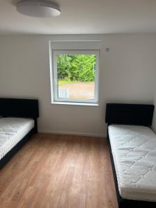 Postel nebo postele na pokoji v ubytování Arbeiter Monteur Wohnung + 3 fotografie