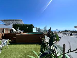 a backyard with a pool on the roof of a house at Villa Verde Sidi Bou Said in Sidi Bou Saïd