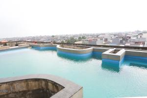 arial view of a body of water with buildings at Hotel Metropolitan Park 6 Hour Stay in Bekasi