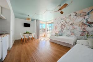 a living room with a couch and a table at Nura Houses Magaluf Beach - Duplex Apt in Magaluf
