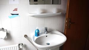 Koupelna v ubytování Ferienhaus DünenRose + 21 fotografií