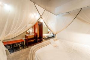 Voodi või voodid majutusasutuse Nguni Lodge toas