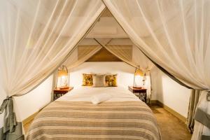 Voodi või voodid majutusasutuse Nguni Lodge toas