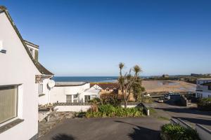 a view of the ocean from the balcony of a house at Casa Sirena Apartment in Fistral, Newquay in Newquay