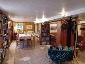 a living room with a table and a dining room at Ferienhof Landfrieden in Vollerwiek +13 photos