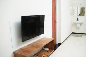 TV a/nebo společenská místnost v ubytování Tech Nest Kazhakkoottam