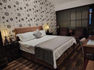 Postel nebo postele na pokoji v ubytování Jingshan Garden Hotel