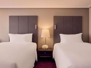 Voodi või voodid majutusasutuse Sofitel Brisbane Central toas
