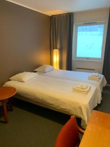 Postel nebo postele na pokoji v ubytování Narvik Budget Rooms