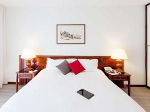 Postel nebo postele na pokoji v ubytování Aparthotel Adagio Rome Vatican