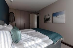 Andermatt Arve Relax by Quokka 360客房内的一张或多张床位