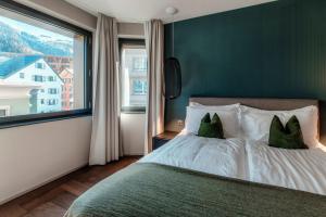 Andermatt Arve Relax by Quokka 360客房内的一张或多张床位