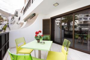 a small balcony with a table and chairs at Santana Sunshine by Sunkeyrents in Santiago del Teide