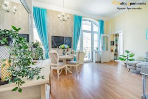 TV a/nebo společenská místnost v ubytování Baltic Apartments - Willa Carmen
