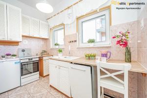 Kuchyň nebo kuchyňský kout v ubytování Baltic Apartments - Willa Carmen