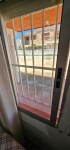 an open door with a view of a building at Habitaciones en Chalet 1º linea de playa in Cullera