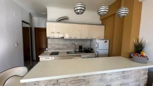Kuchyň nebo kuchyňský kout v ubytování Gouris Appartements