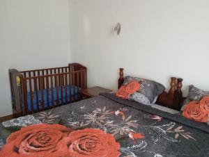 a bedroom with two beds and a crib at Perfect Place - Djenovici in Herceg-Novi