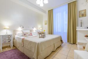 Postel nebo postele na pokoji v ubytování Guest House Flores