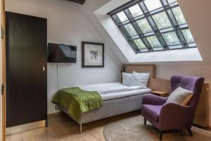 Ліжко або ліжка в номері The More Hotel Lund
