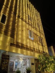a building with a lot of lights on it at Leela Residency velankanni in Velankanni