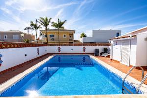 a swimming pool in the backyard of a villa at Villa Leonie in Lagos