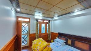Ένα ή περισσότερα κρεβάτια σε δωμάτιο στο Jai Durga Maa Cottage Home Stay