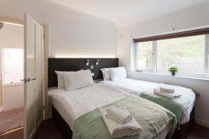 Ένα ή περισσότερα κρεβάτια σε δωμάτιο στο Cosy 3 bedroom house in quiet residential area