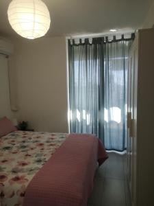 A bed or beds in a room at La terrazza sul mare