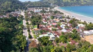 an aerial view of a town next to the beach at Pousada Bettys in Ubatuba