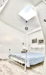 Postel nebo postele na pokoji v ubytování 1922 Epoch Harmony Oikia