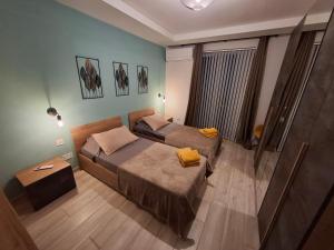 Postel nebo postele na pokoji v ubytování Serenity Apartment