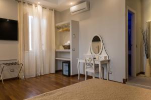 TV a/nebo společenská místnost v ubytování Borghese Executive Suite