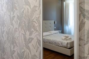 Postel nebo postele na pokoji v ubytování Borghese Executive Suite