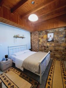 En eller flere senge i et værelse på Μεζονέτα