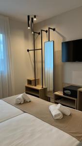 Postel nebo postele na pokoji v ubytování Hotel MLC San Sebastian
