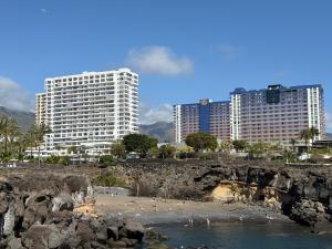 a beach with two tall buildings in the background at CasaMaria in Playa Paraiso