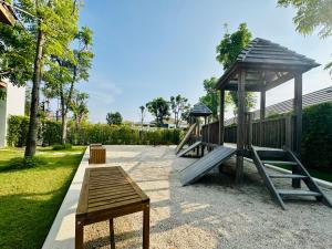 a playground with a slide and a gazebo at Mouana Breeze Mai Khao 4-bedroom Pool Villa 9918 in Mai Khao Beach