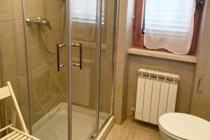 a bathroom with a shower and a toilet at Villa Marina primo piano in Rio Marina