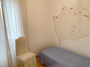 En eller flere senge i et værelse på Villa Marina primo piano