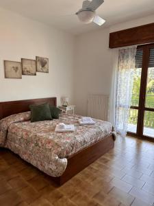 A bed or beds in a room at Little house Lezzeno