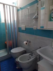 a bathroom with a toilet and a sink and a shower at Cantone Studio On The Beach in Cetara +19 photos