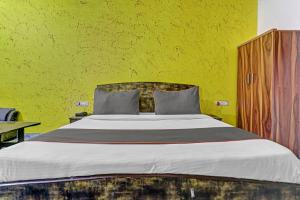 Postel nebo postele na pokoji v ubytování Hotel O One Plus One Residency