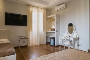 TV a/nebo společenská místnost v ubytování Borghese Executive Suite